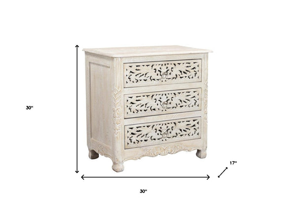 Homeroots 30" Distressed White Three Drawer Floral Carved Solid Wood Nightstand   521193
