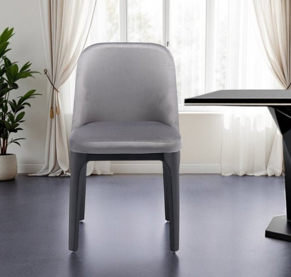 HomeRoots Gray Velvet Upholstered Dining Side Chair - Modern Armless Design with Black Legs for Versatile Comfort 521278
