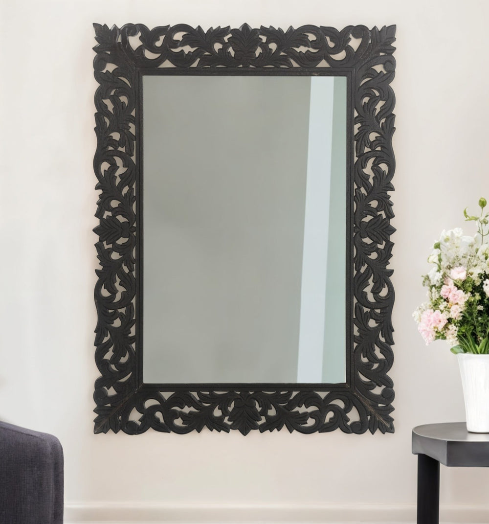 Homeroots 47" Black  Floral Carved Solid Wood Framed Accent Mirror  Wood 521567