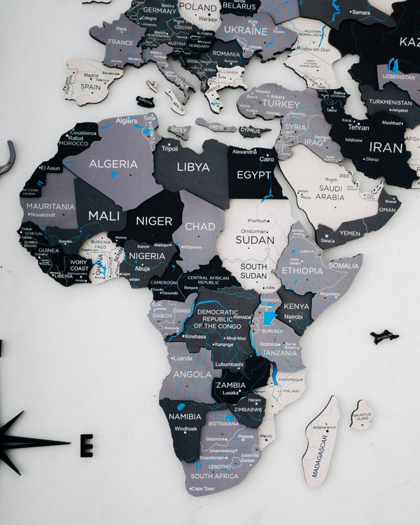 HomeRoots 24" Handcrafted Dimensional Black and Gray World Map Wall Art - Unique Travel-Inspired Decor Piece 521592