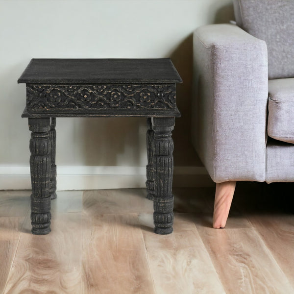 HomeRoots 24" Black Distressed Solid Wood End Table - Rustic Charm with Intricate Carvings for Versatile Use 521959