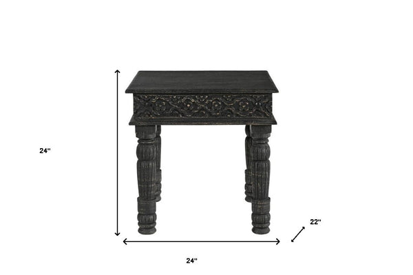 HomeRoots 24" Black Distressed Solid Wood End Table - Rustic Charm with Intricate Carvings for Versatile Use 521959