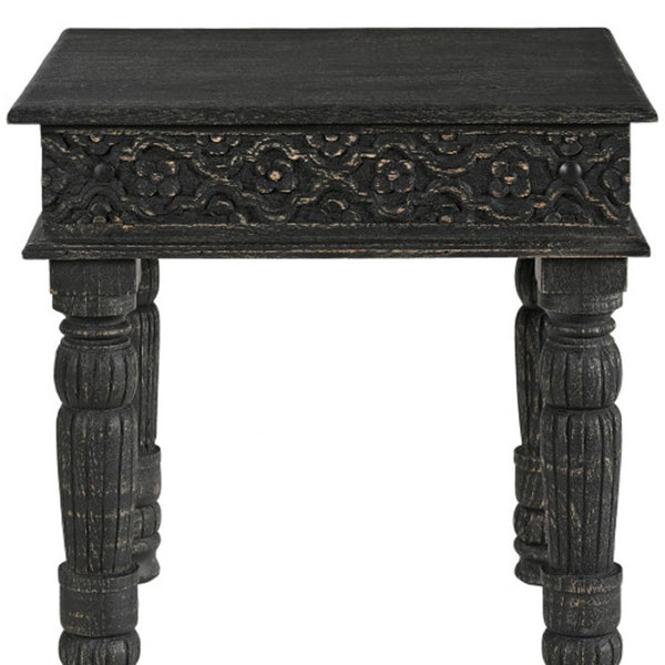 HomeRoots 24" Black Distressed Solid Wood End Table - Rustic Charm with Intricate Carvings for Versatile Use 521959