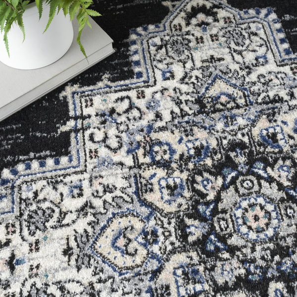 Homeroots 5' X 7' Black Floral Power Loom Distressed Area Rug  Polypropylene 522457