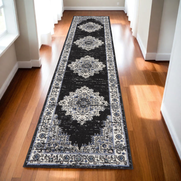 Homeroots 10' Runner Black And Ivory Floral Power Loom Distressed Runner Rug  Polypropylene 522459