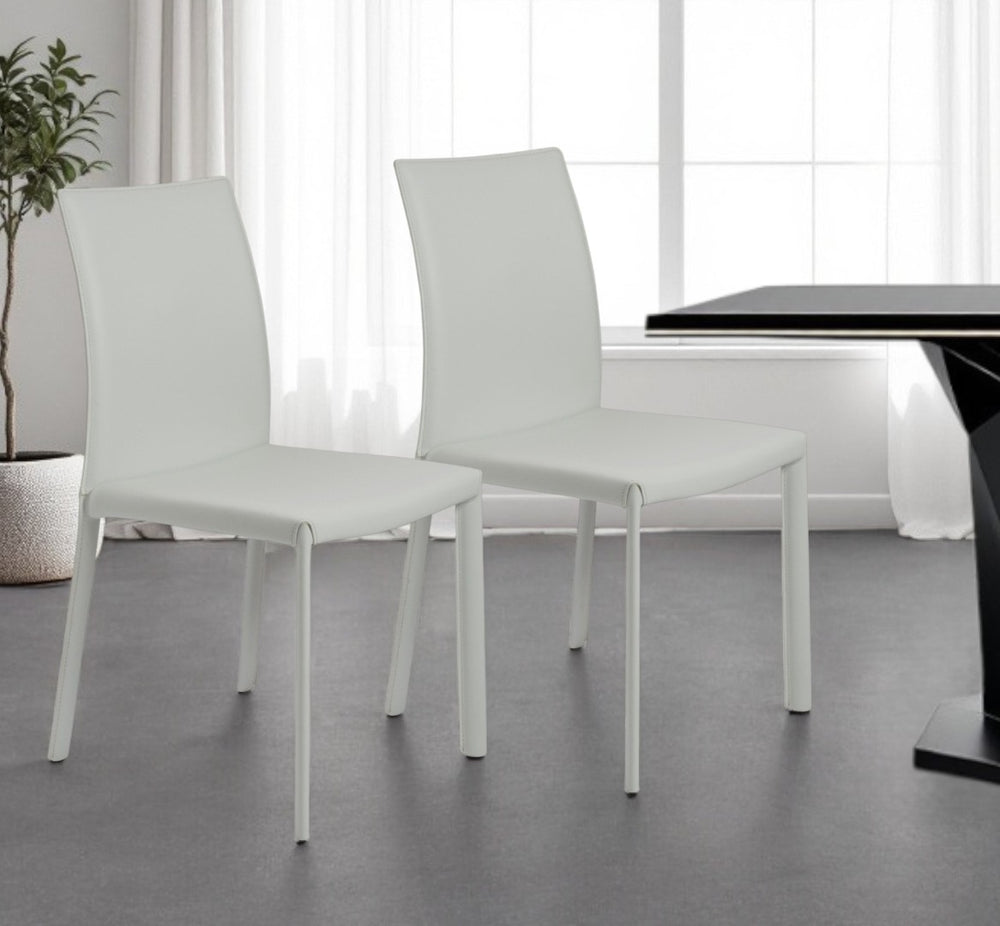 HomeRoots Set of Two Contemporary White Upholstered Leather Dining Chairs for Modern Spaces and Comfort 523968