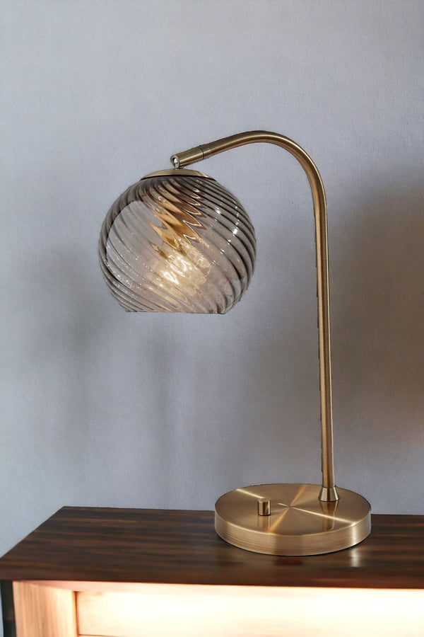 Homeroots 19" Antiqued Brass Metal Desk Lamp With Light Gray Swirl Globe Shade   524630