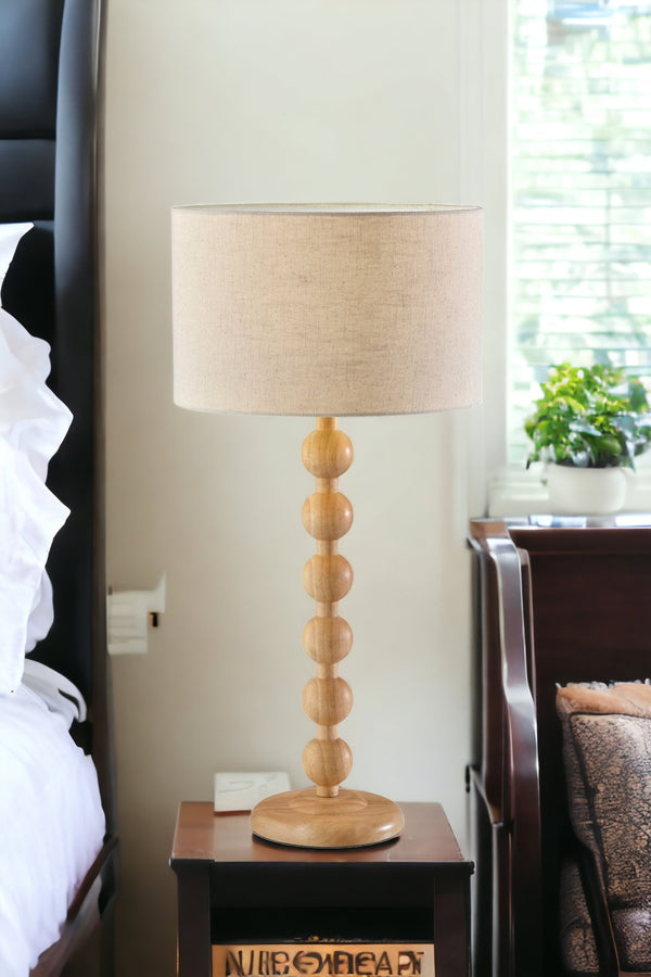 Homeroots 28" Brown Solid Wood Candlestick Table Lamp With Off White Drum Shade   524632