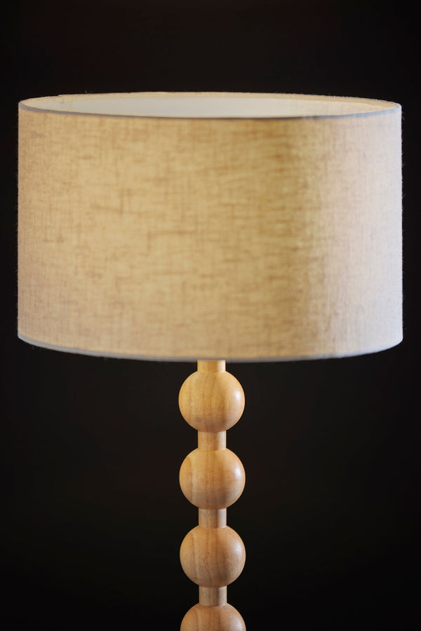 Homeroots 28" Brown Solid Wood Candlestick Table Lamp With Off White Drum Shade   524632