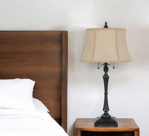 HomeRoots 31" Elegant Black Metal Two-Light Candlestick Table Lamp with Soft Beige Shade for Any Decor 524692