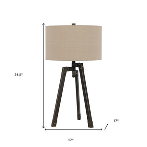 HomeRoots 32" Charcoal Metal Tripod Table Lamp with Tan Linen Shade - Stylish Ambient Lighting for Any Space 524695
