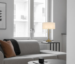 Homeroots 20" Antiqued Brass Metal Two Light Table Lamp With White Drum Shade   524727