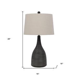 HomeRoots 29" Elegant Black Ceramic Table Lamp with Beige Shade for Stylish Lighting in Any Room 524746