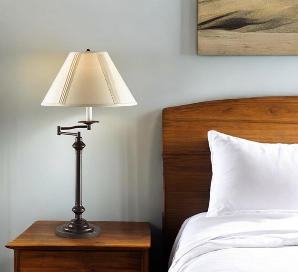 Homeroots 30" Antiqued Bronze Metal Swing Arm Table Lamp With Off White Empire Shade   524751