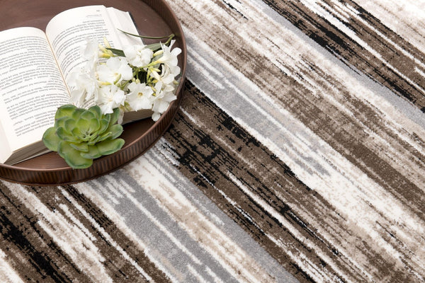 HomeRoots 5' Brown Round Abstract Area Rug - Stylish Geometric Design, Washable, Non-Skid, Durable & Versatile 524922
