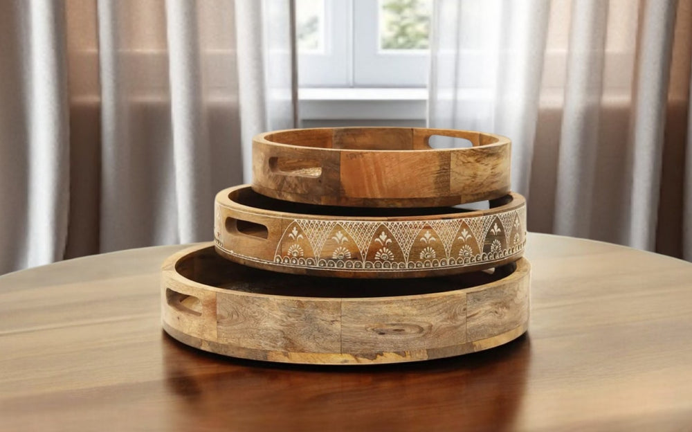 HomeRoots Set of Three Handmade Mango Wood Serving Trays with Floral Design & Cutout Handles for Versatile Use 526351