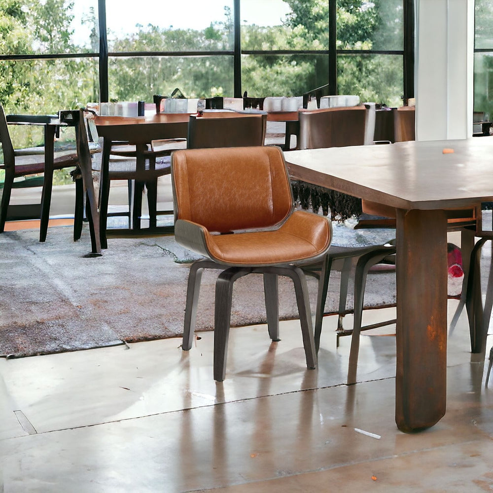 Homeroots Brown And Black Upholstered Faux Leather Curved Back Dining Side Chair  Wood 526378