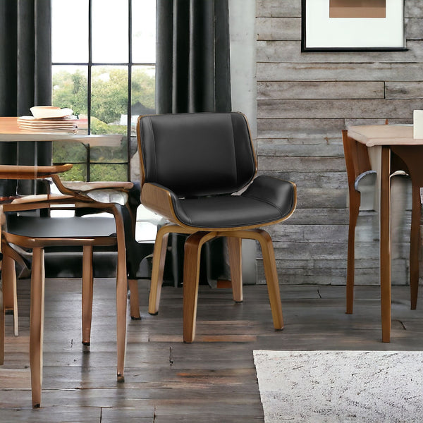 Homeroots Black And Brown Upholstered Faux Leather Curved Back Dining Side Chair  Wood 526379