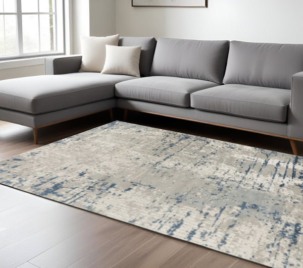 HomeRoots 9' Abstract Distressed Area Rug in Ivory, Gray, and Blue - Modern Artistry for Any Space 10' X 14' 527678