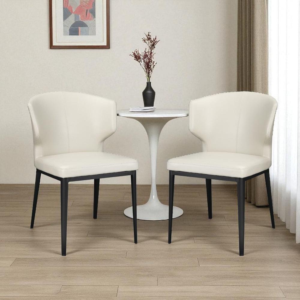 HomeRoots Set of Two Elegant Beige and Black Wing Back Dining Chairs - Upholstered Faux Leather Comfort 527813