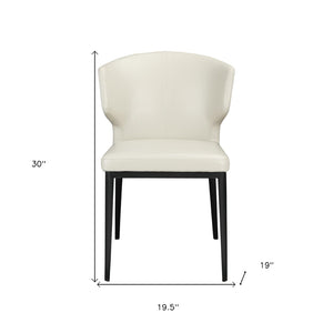 HomeRoots Set of Two Elegant Beige and Black Wing Back Dining Chairs - Upholstered Faux Leather Comfort 527813