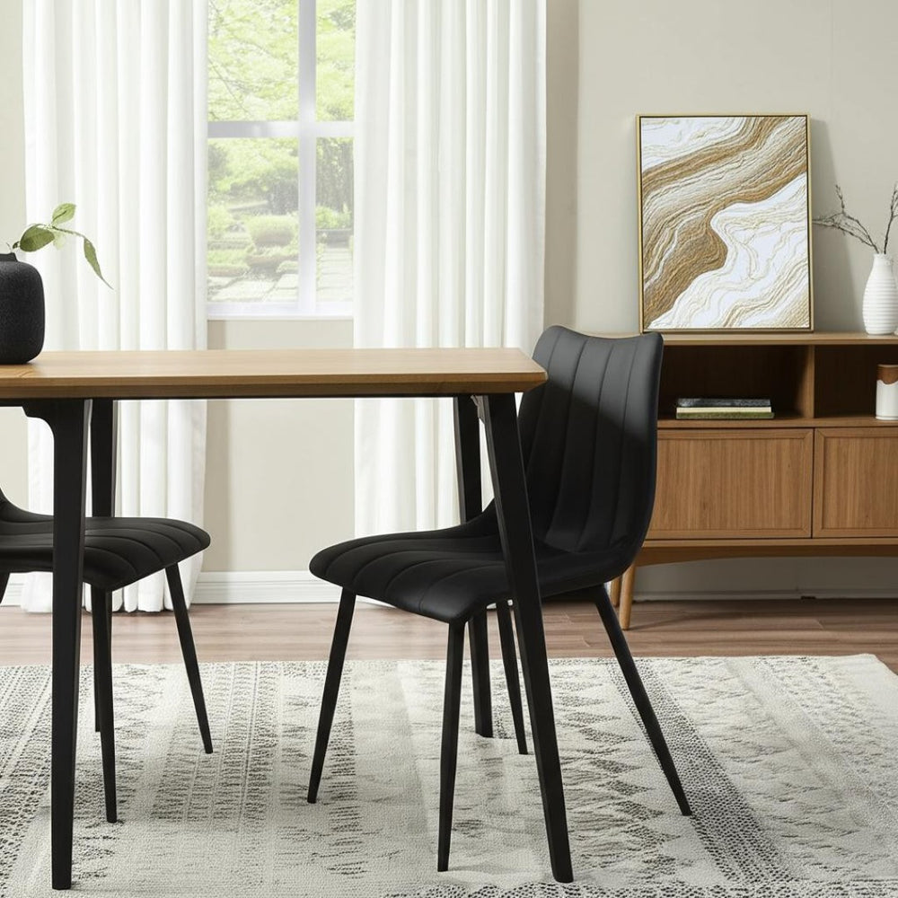 HomeRoots Set of Two Stylish Black Faux Leather Dining Chairs with Metal Frame for Modern Spaces 527824