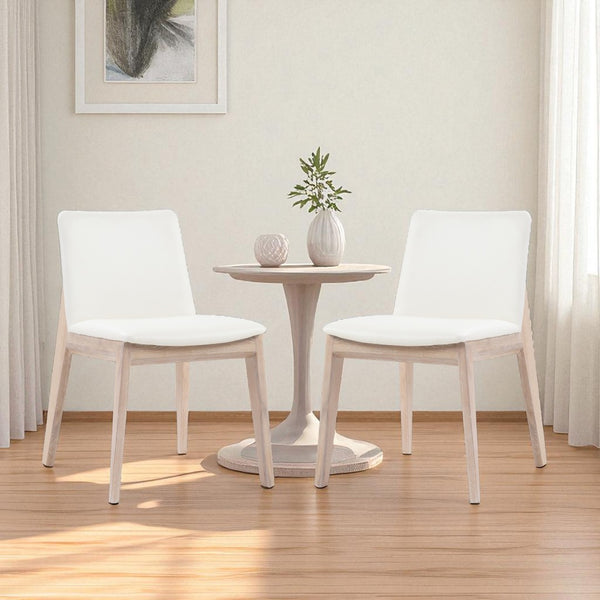 HomeRoots Set of Two Stylish Upholstered Faux Leather Dining Chairs with Natural-Finish Legs for Versatility 527827