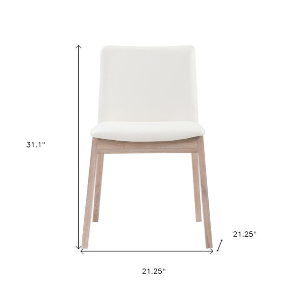 HomeRoots Set of Two Stylish Upholstered Faux Leather Dining Chairs with Natural-Finish Legs for Versatility 527827