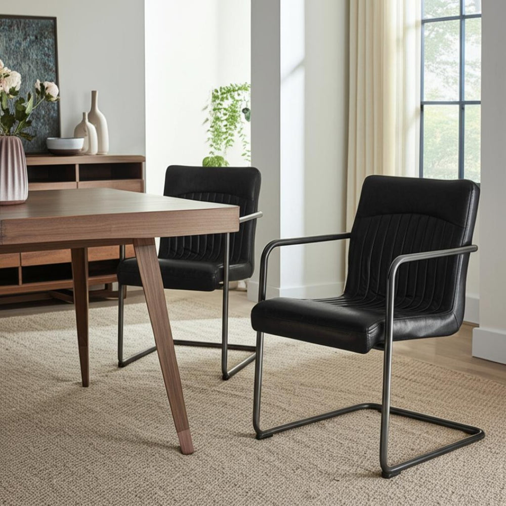 HomeRoots Set of Two Contemporary Black Leather and Iron Dining Chairs for Stylish Comfort and Versatility 527911