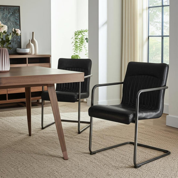 HomeRoots Set of Two Contemporary Black Leather and Iron Dining Chairs for Stylish Comfort and Versatility 527911