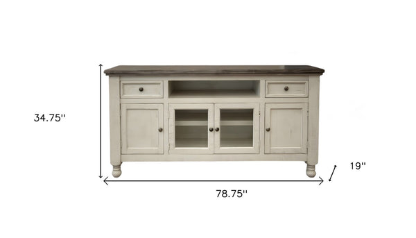 HomeRoots 79" Ivory Solid Pine TV Stand - Distressed Finish, Open Shelving & Versatile Storage for Any Room 528714