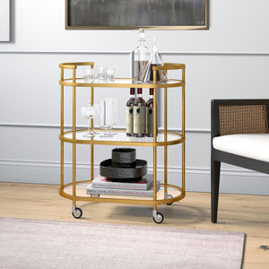 Homeroots Brass Steel And Glass Oval Rolling Bar Cart   530454