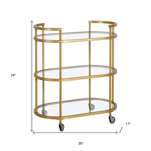 Homeroots Brass Steel And Glass Oval Rolling Bar Cart   530454