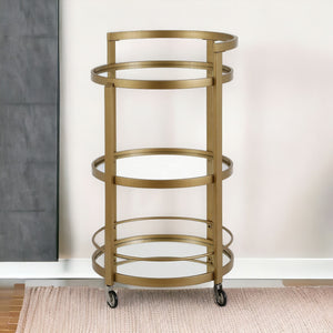 Homeroots Brass Steel And Glass Round Rolling Bar Cart   530458