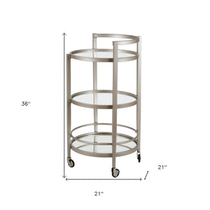 Homeroots Nickel Steel And Glass Round Rolling Bar Cart   530459