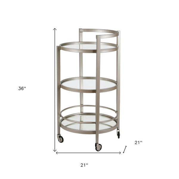 Homeroots Nickel Steel And Glass Round Rolling Bar Cart   530459