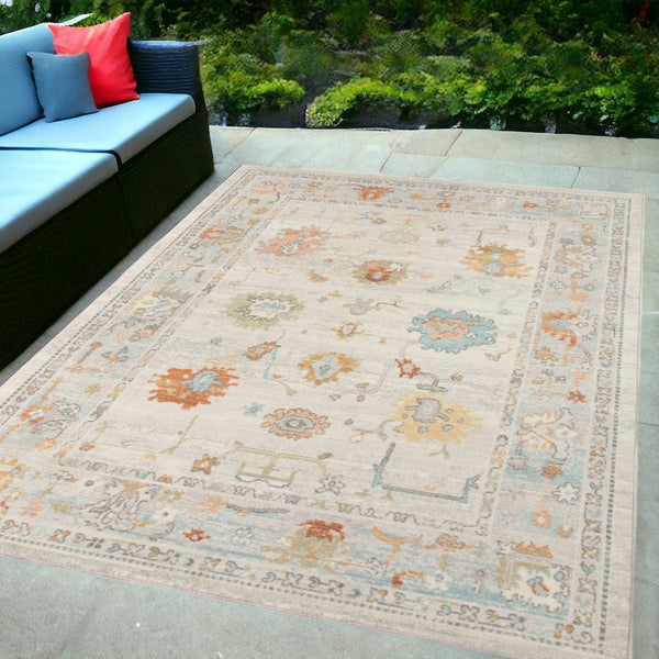 Homeroots 5' X 7' Blue And Orange Floral Stain Resistant Indoor Outdoor Area Rug Beige Polypropylene 531489