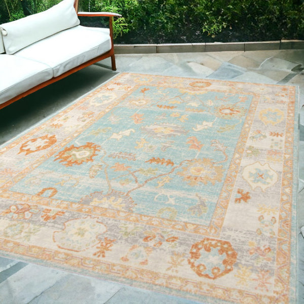 HomeRoots 5' Blue and Orange Floral Area Rug - Stain Resistant, Durable Design for Indoor or Outdoor Spaces Aqua 5'1" x 7'6" 531497