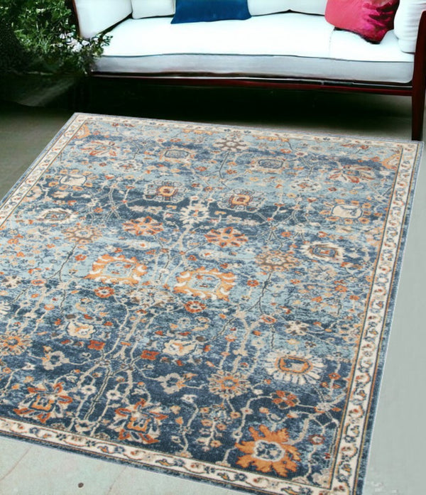 HomeRoots 5' Blue and Orange Floral Area Rug - Stain Resistant, Durable Design for Indoor & Outdoor Spaces Navy 5'1" x 7'6" 531505