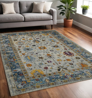 HomeRoots 5' Gray Blue and Orange Area Rug - Durable Persian Floral Design, Stain-Resistant, Ideal for Homes 5' x 7' 531544