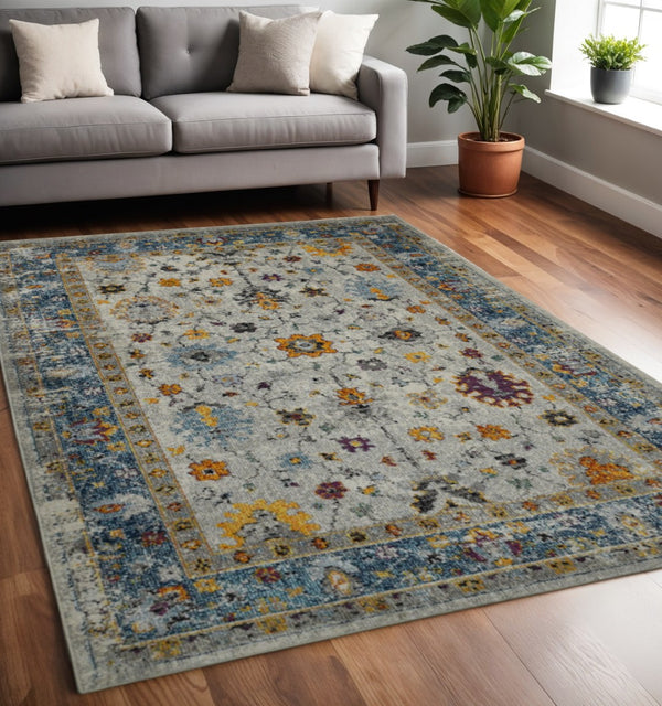 HomeRoots 5' Gray Blue and Orange Area Rug - Durable Persian Floral Design, Stain-Resistant, Ideal for Homes 5' x 7' 531544