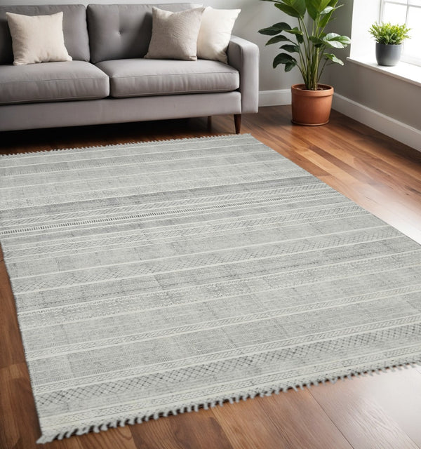 HomeRoots 5' Handmade Flatweave Area Rug with Distressed Geometric Pattern and Fringed Edges for Stylish Homes 5' X 8' 532031