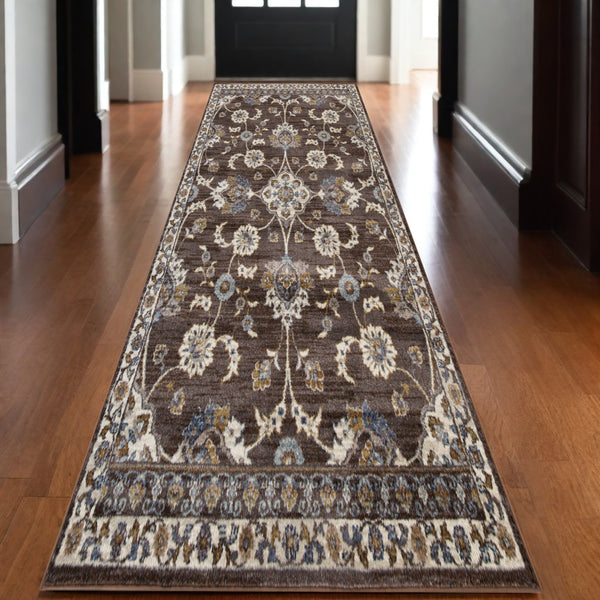 Homeroots 10' Ivory Blue And Brown Floral Power Loom Runner Rug  Polypropylene 532148