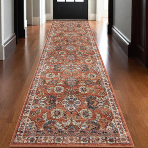Homeroots 10' Ivory Blue And Orange Floral Power Loom Runner Rug  Polypropylene 532160