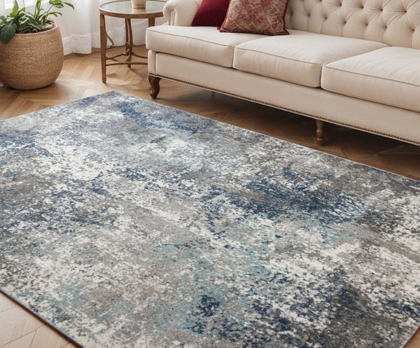 HomeRoots 9' Modern Abstract Area Rug in Ivory, Blue, and Gray - Soft, Durable, and Stylish for Any Room 5' X 8' 532396