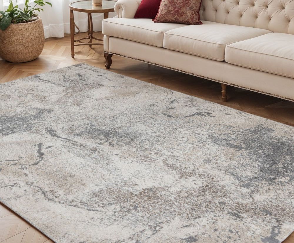 HomeRoots 9' Cream and Gray Abstract Area Rug - Power Loomed for Modern Elegance and Everyday Durability 5' X 8' 532402