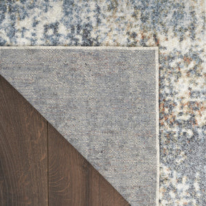 HomeRoots 9' Abstract Blue and Ivory Distressed Area Rug - Stylish, Washable, Perfect for High-Traffic Spaces 9' X 12' 532833