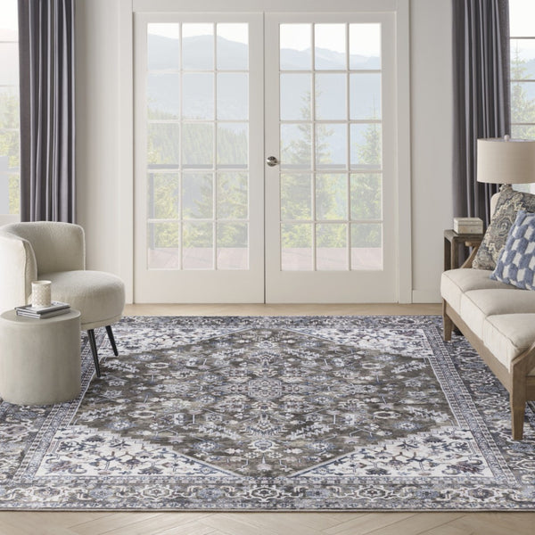 HomeRoots 9' X 12' Floral Power Loom Distressed Washable Area Rug for Timeless Elegance in Any Room Green, Ivory 533127