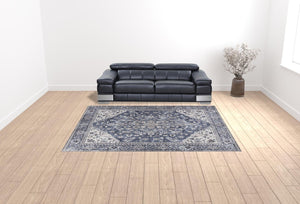 HomeRoots 9' X 12' Floral Power Loom Distressed Washable Area Rug for Timeless Elegance in Any Room Blue, Ivory 533133