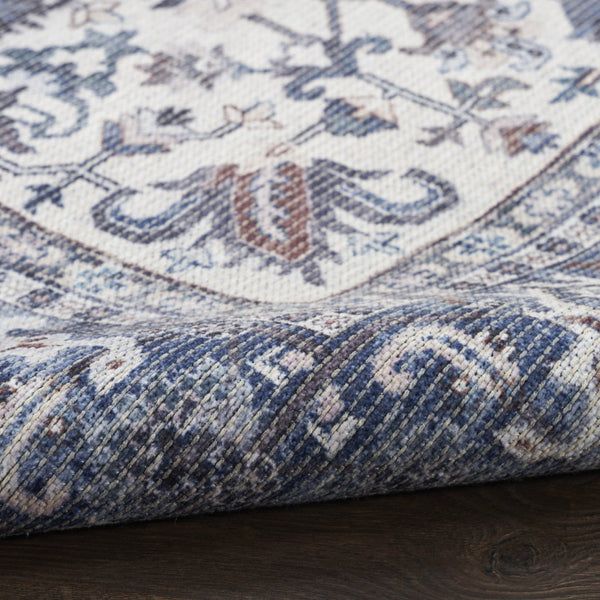 HomeRoots 9' X 12' Floral Power Loom Distressed Washable Area Rug for Timeless Elegance in Any Room Blue, Ivory 533133